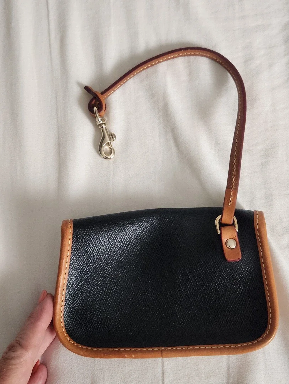 Dooney and Bourke Pebbled Leather Bristol Pouch with Clip Black w Brown Trim